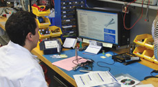 One of our lab technicians calibrating an instrument for a customer