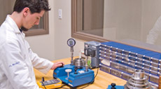 One of the lab technicians repairing a humidity instrument
